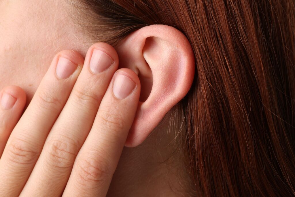 patient asking pharmacist about blocked ears and ear wax removal in Harrow